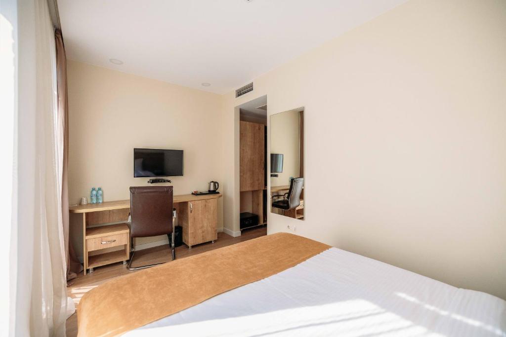 TV a/nebo společenská místnost v ubytování Atrium Boutique Hotel