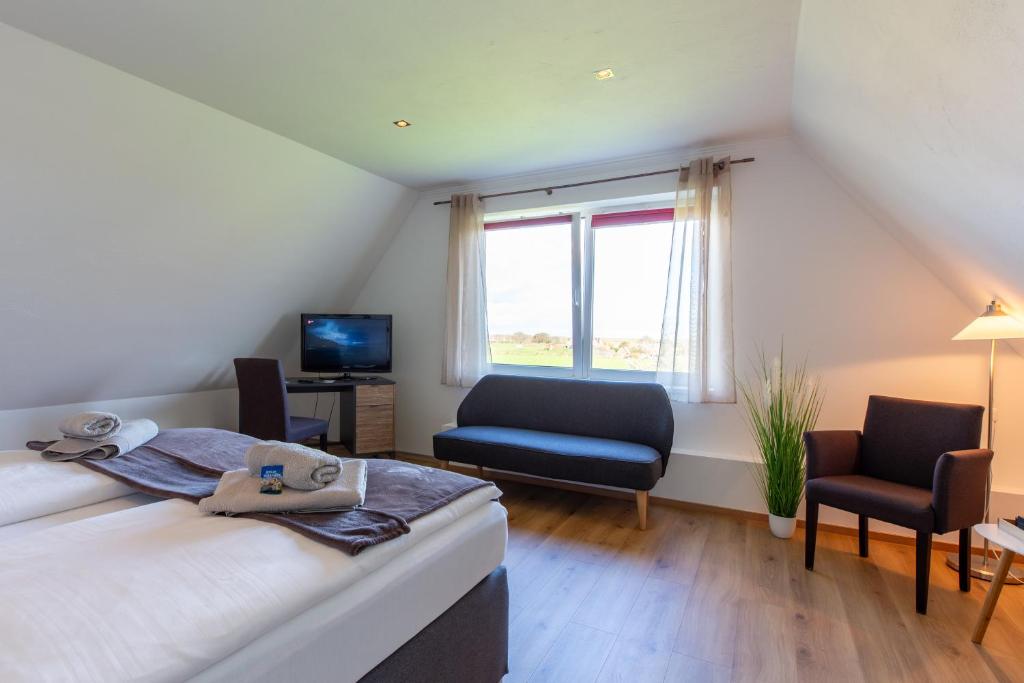 Postel nebo postele na pokoji v ubytování Hotel MeerLand Pellworm