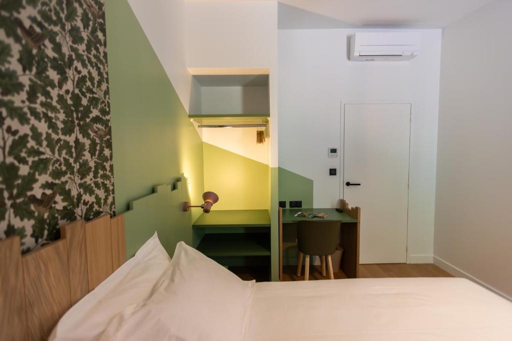 Posteľ alebo postele v izbe v ubytovaní Hôtel - Lodges de Lemptégy