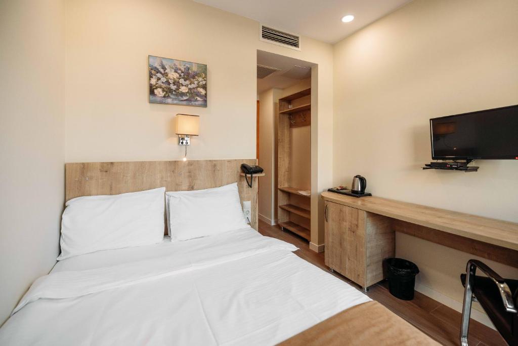 Postel nebo postele na pokoji v ubytování Atrium Boutique Hotel