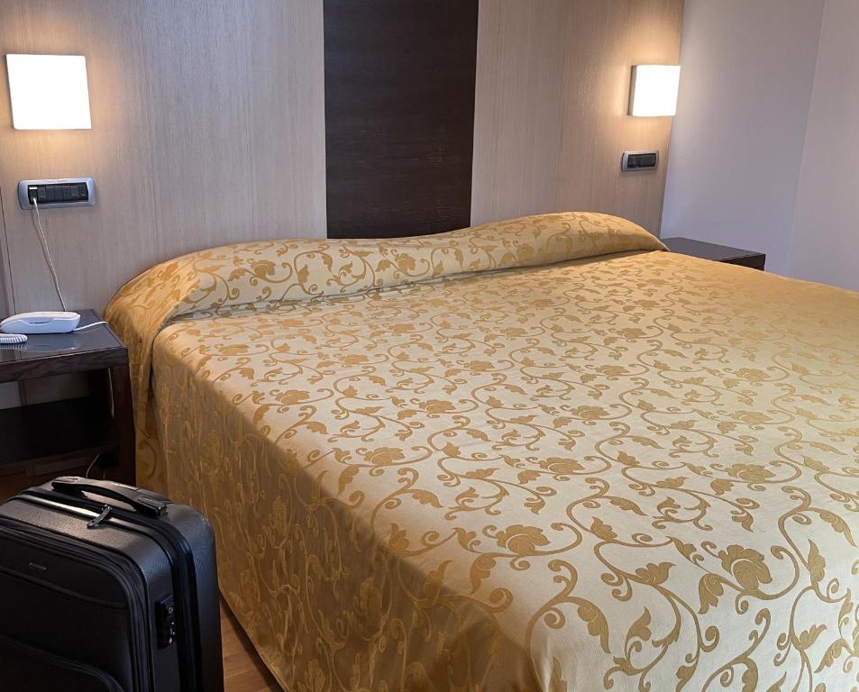 Postel nebo postele na pokoji v ubytování Hotel Corte Quadri