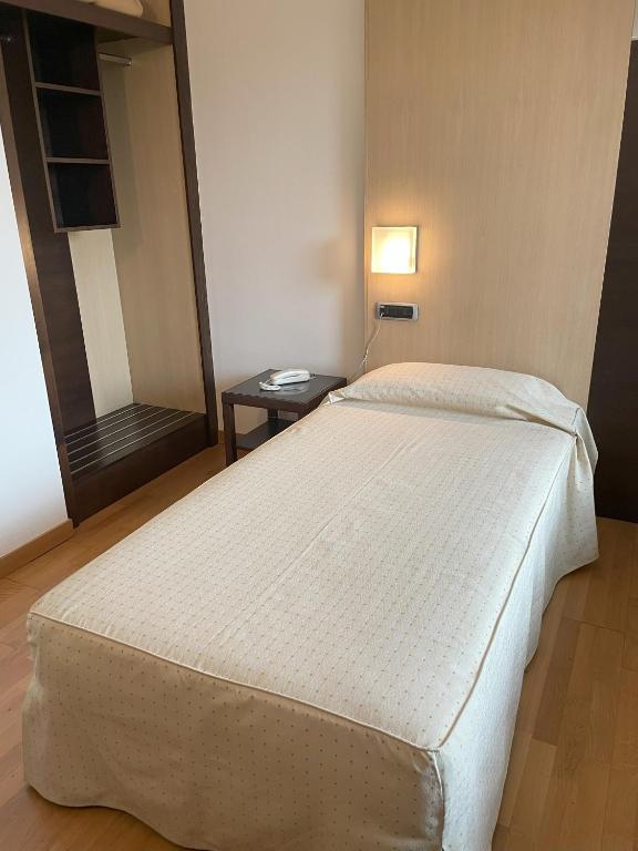 Postel nebo postele na pokoji v ubytování Hotel Corte Quadri