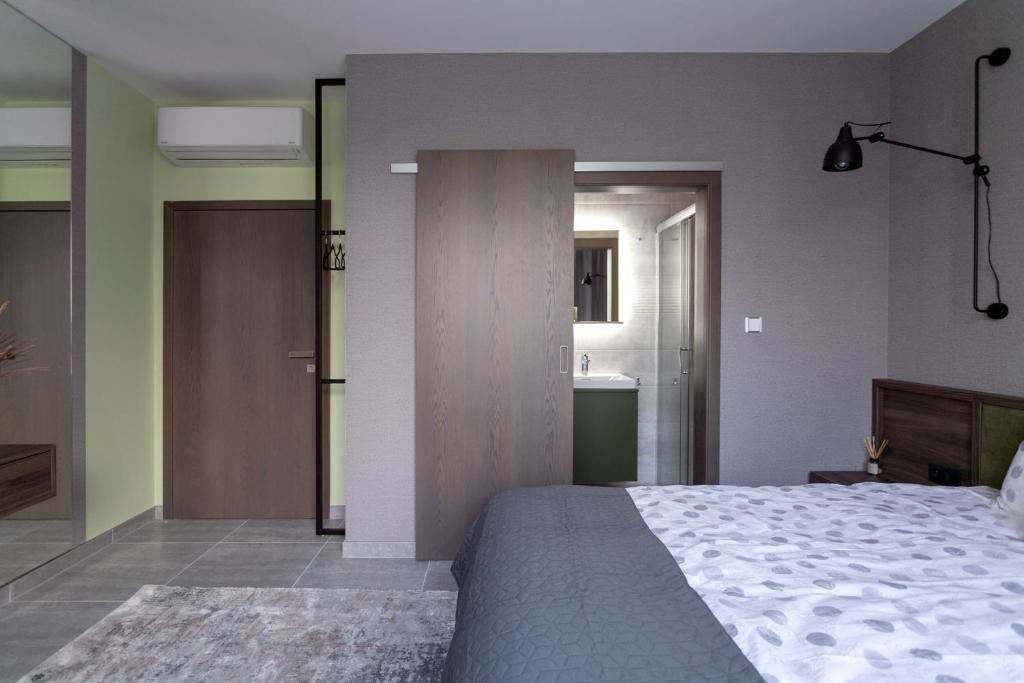 Postel nebo postele na pokoji v ubytování LUONG Europe Apartments