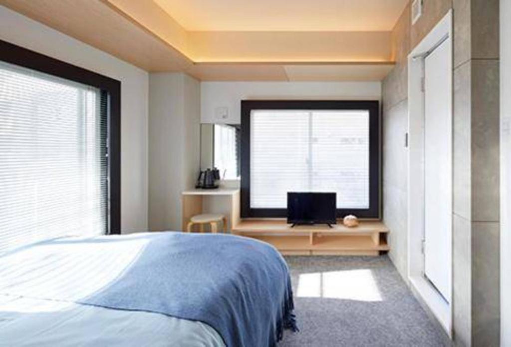 Ένα ή περισσότερα κρεβάτια σε δωμάτιο στο Kimura Building - Vacation STAY 15558