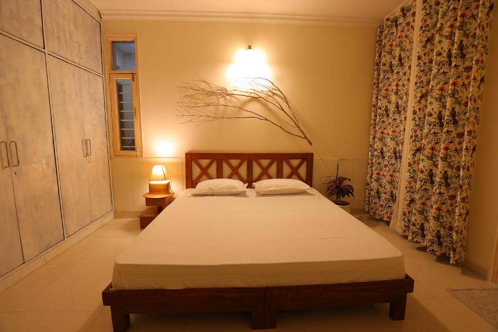 a bedroom with a bed in a room at Soul'Stay- A HomeStay & Retreat Center in Agra