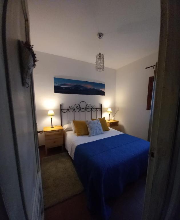 A bed or beds in a room at Al Viento, Alojamiento & Turismo Rural Prádena del Rincón