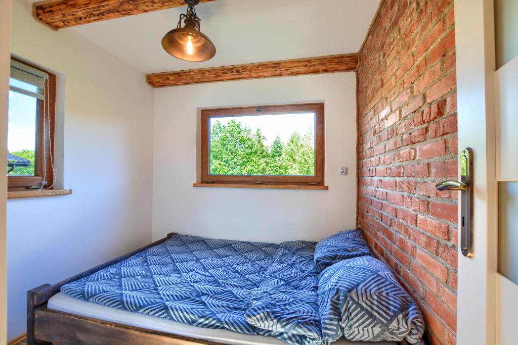 Postel nebo postele na pokoji v ubytování Osada Sroczy Jar