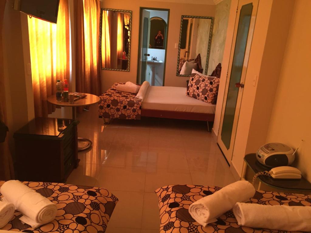 Postel nebo postele na pokoji v ubytování Hotel Business