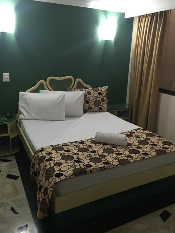 Postel nebo postele na pokoji v ubytování Hotel Business