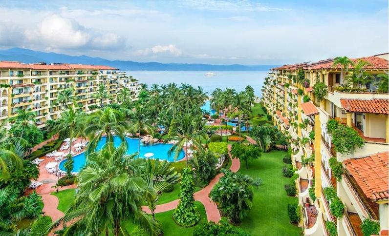 an aerial view of a resort with a swimming pool at Oceanview Condo Vela Vallarta condo in Puerto Vallarta