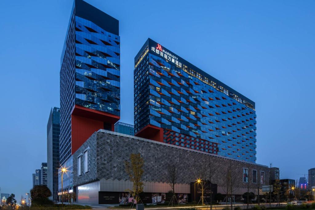 a tall building next to a building at Chengdu Marriott Hotel Financial Centre in Chengdu