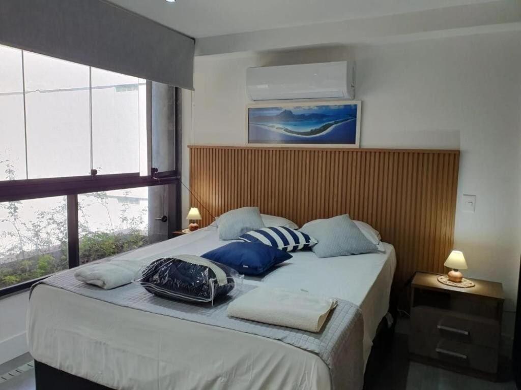 Ένα ή περισσότερα κρεβάτια σε δωμάτιο στο Flat Av. Atlantica em frente ao mar, estrutura total
