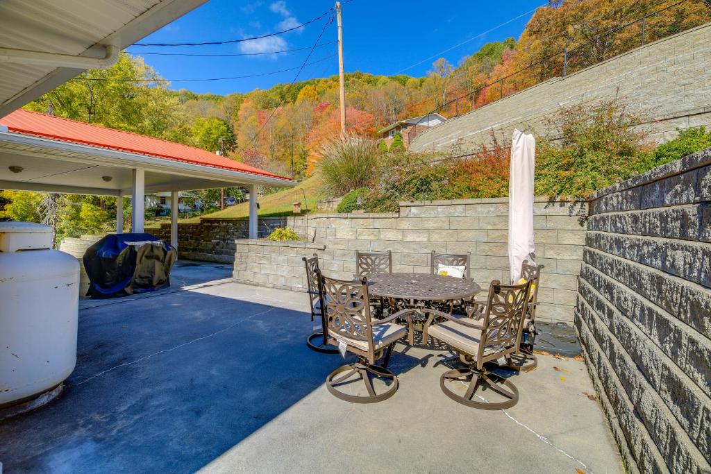 a patio with a table and two chairs at Laptop-Friendly Appalachian Mountain Retreat! in Norton