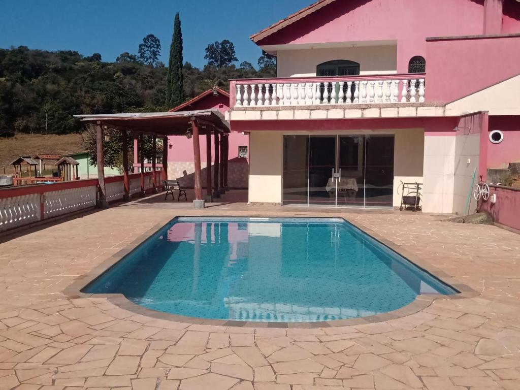 a swimming pool in front of a house at casa donna zilda in Extrema