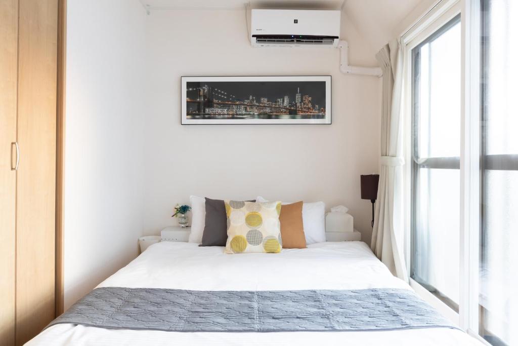 Postel nebo postele na pokoji v ubytování Sakamoto House