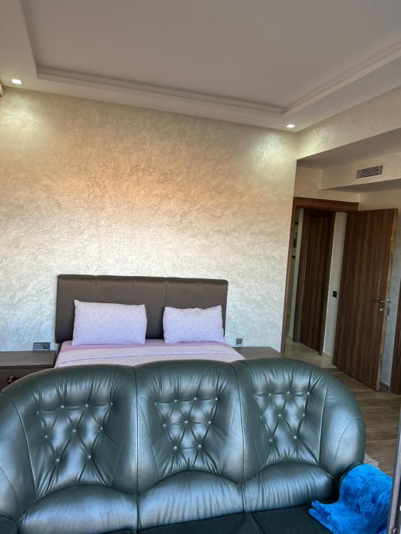A bed or beds in a room at Menara Garden Pool Appartement