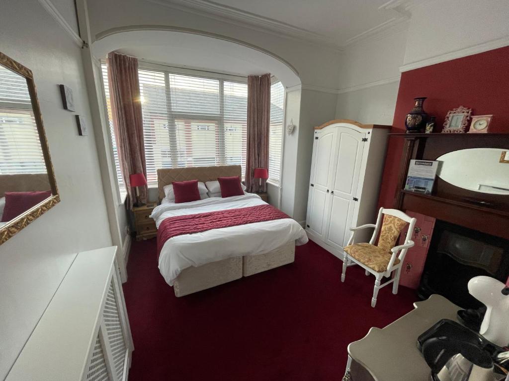 a bedroom with a bed and a sink in it at Lee & Chris's Belvedere - Adults Only in Blackpool