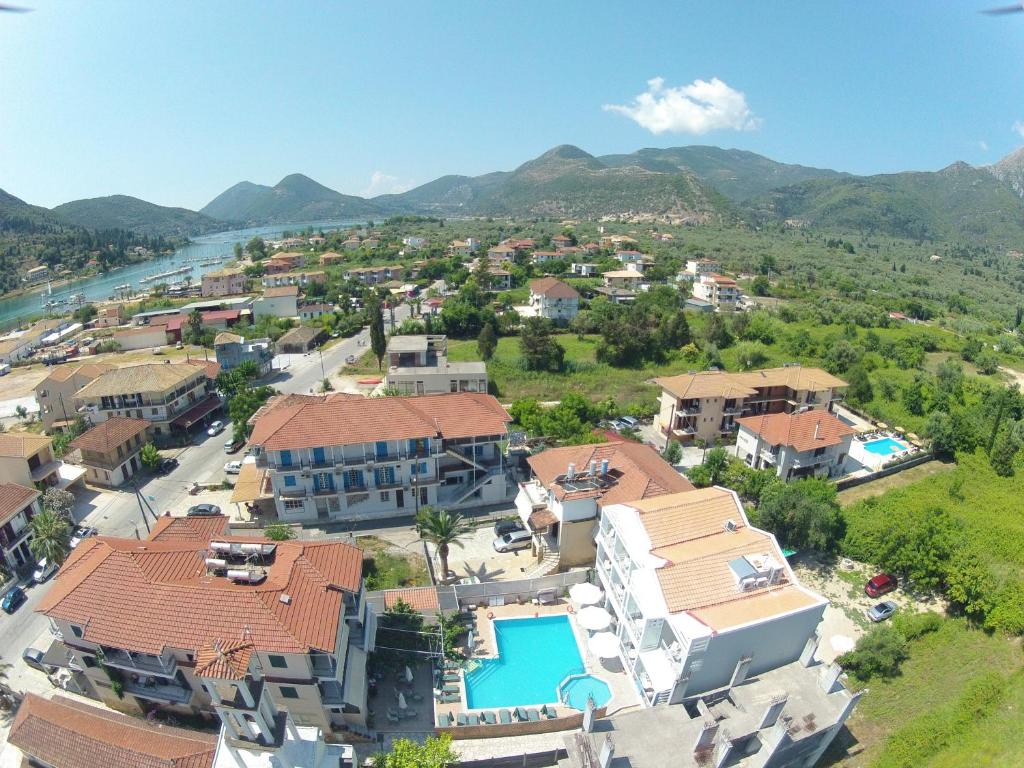 an aerial view of a resort with mountains in the background at Aggelos Apartments & Deluxe Studios in Nydri