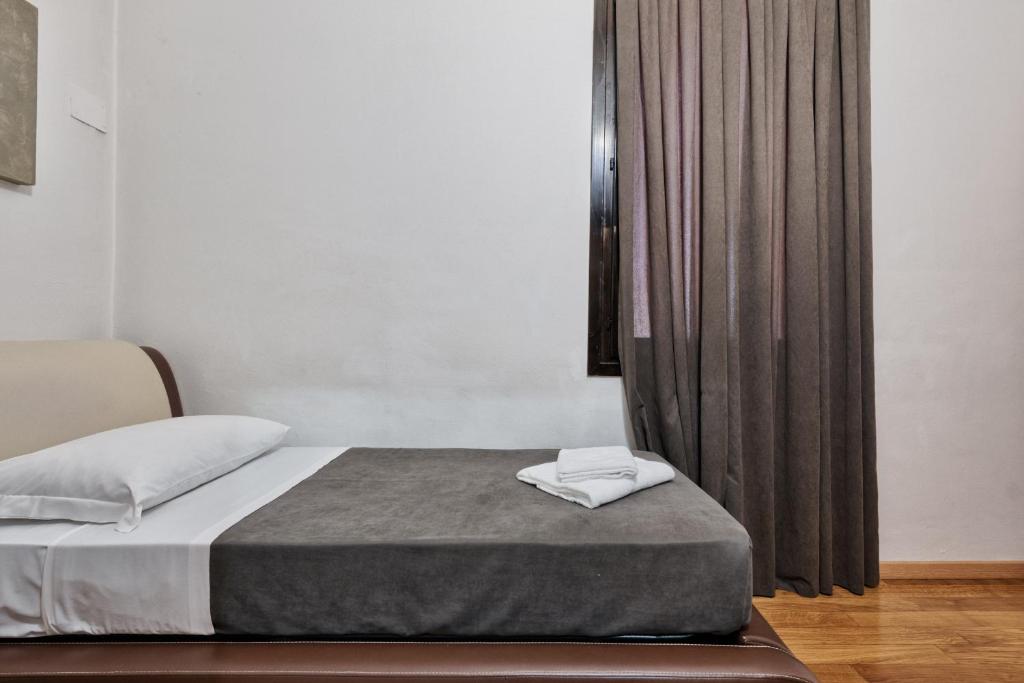 Postel nebo postele na pokoji v ubytování Hotel Trieste