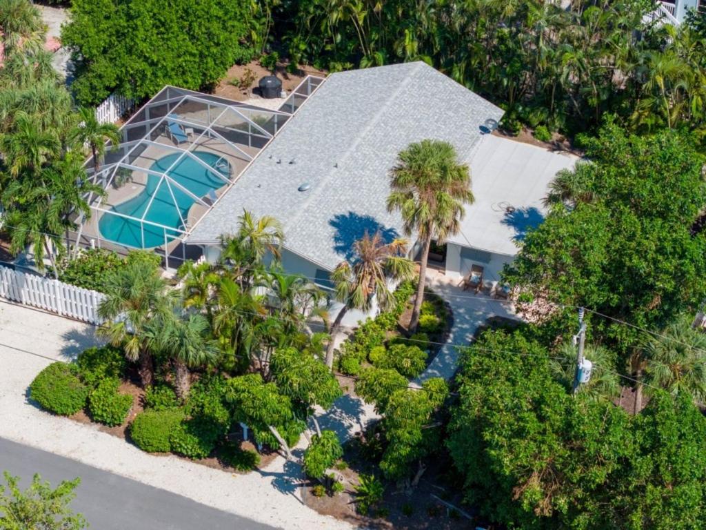 an aerial view of a house with a swimming pool at Wait N' Sea- Previously Millertime home in Captiva