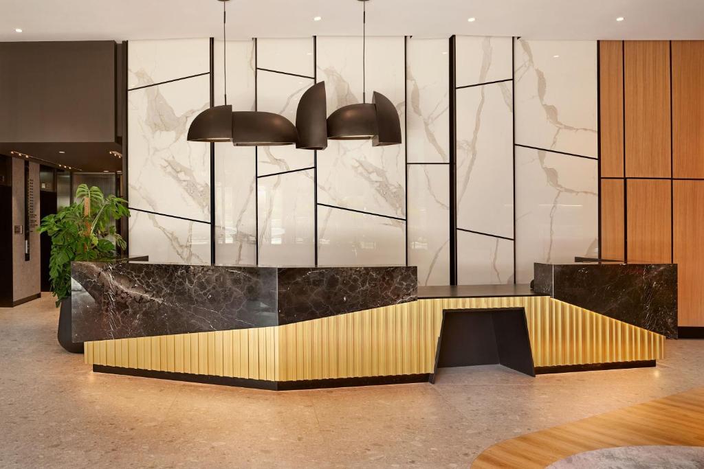 a lobby with a reception desk in a building at AC Hotel by Marriott Split in Split