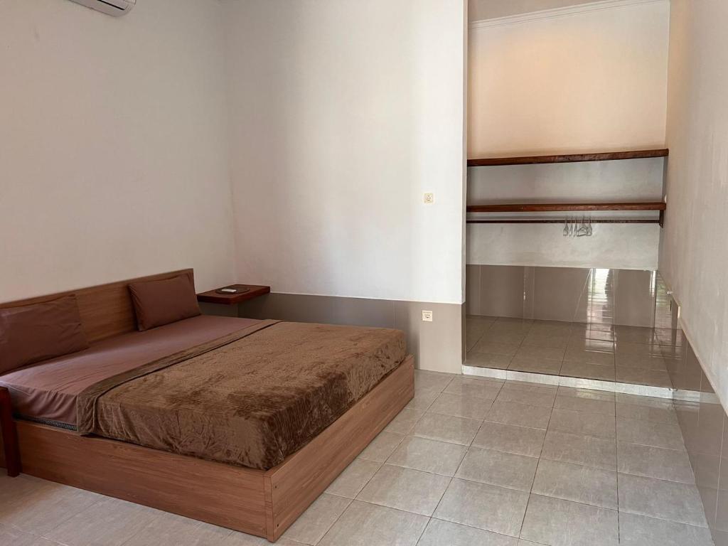 Postel nebo postele na pokoji v ubytování Sayang Bungalows