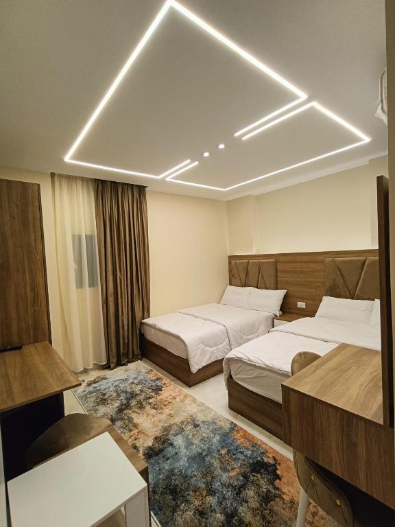 Postel nebo postele na pokoji v ubytování Discover pyramids inn