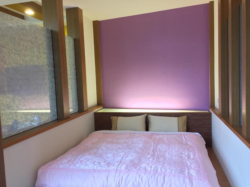 Postel nebo postele na pokoji v ubytování Nantou Xitou Riverside Homestay B&B