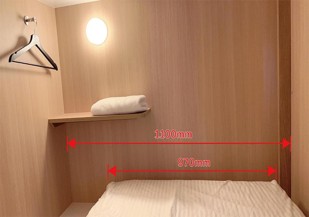 Postel nebo postele na pokoji v ubytování 難波ゲストハウスjakotelplus 難波店
