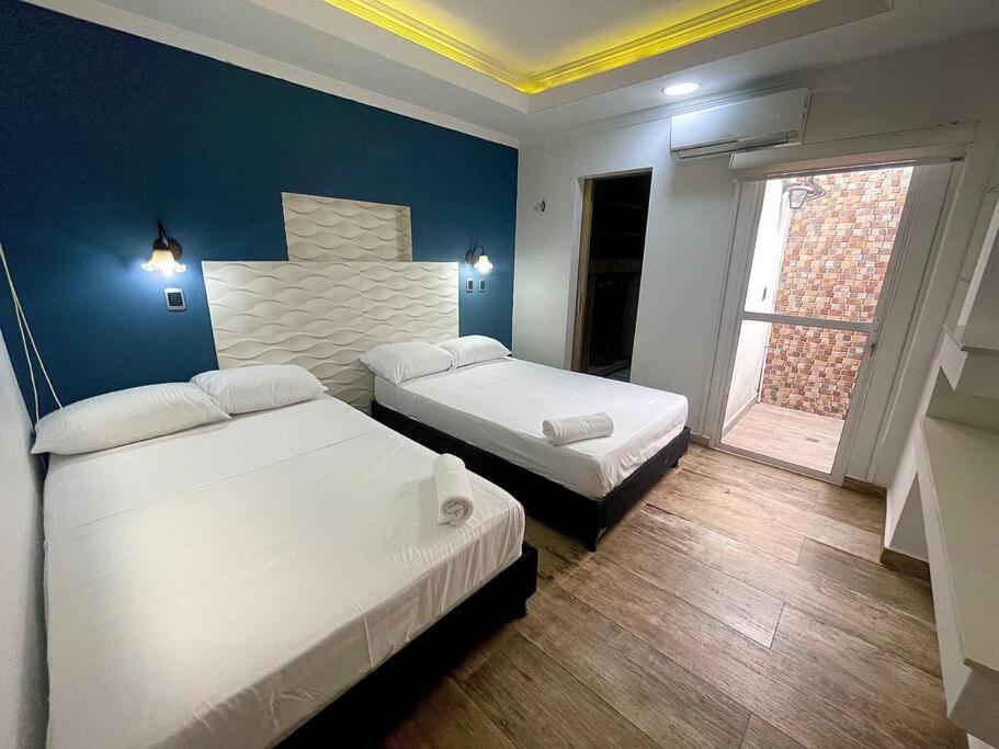 Säng eller sängar i ett rum på Apartamento Laureles-estadio Luxury
