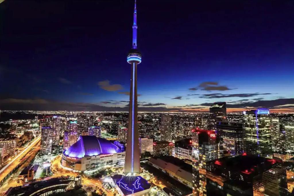 a view of the cn tower at night at Downtown Toronto Gem in Toronto