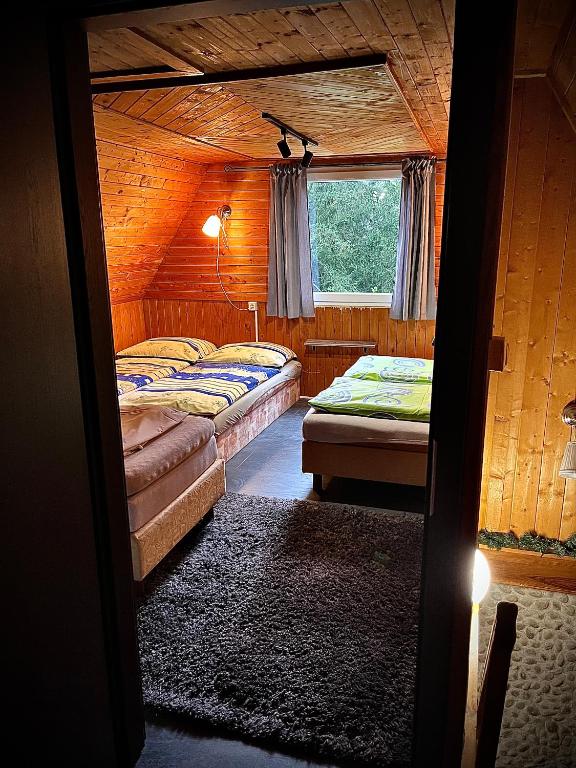 A bed or beds in a room at Chata na Liptove