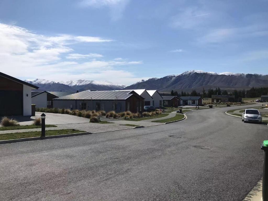 a street with a car parked on the side of a road at 3 Edwards in Lake Tekapo