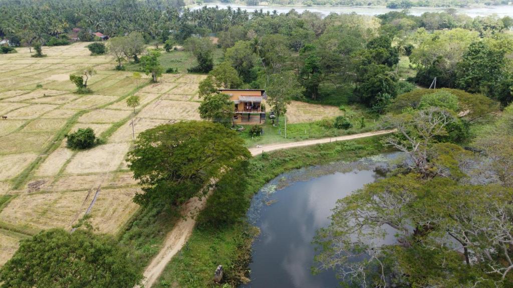 an aerial view of a house next to a river at The Loft by the Lake in Kurunegala