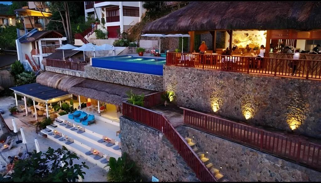 an aerial view of a resort with a swimming pool at Mua Tala Hotel El Nido in El Nido