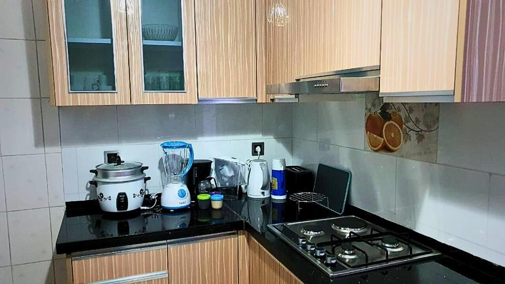 a kitchen with a counter top with a blender at Les Alizés Appartement meublé 3 in Toamasina