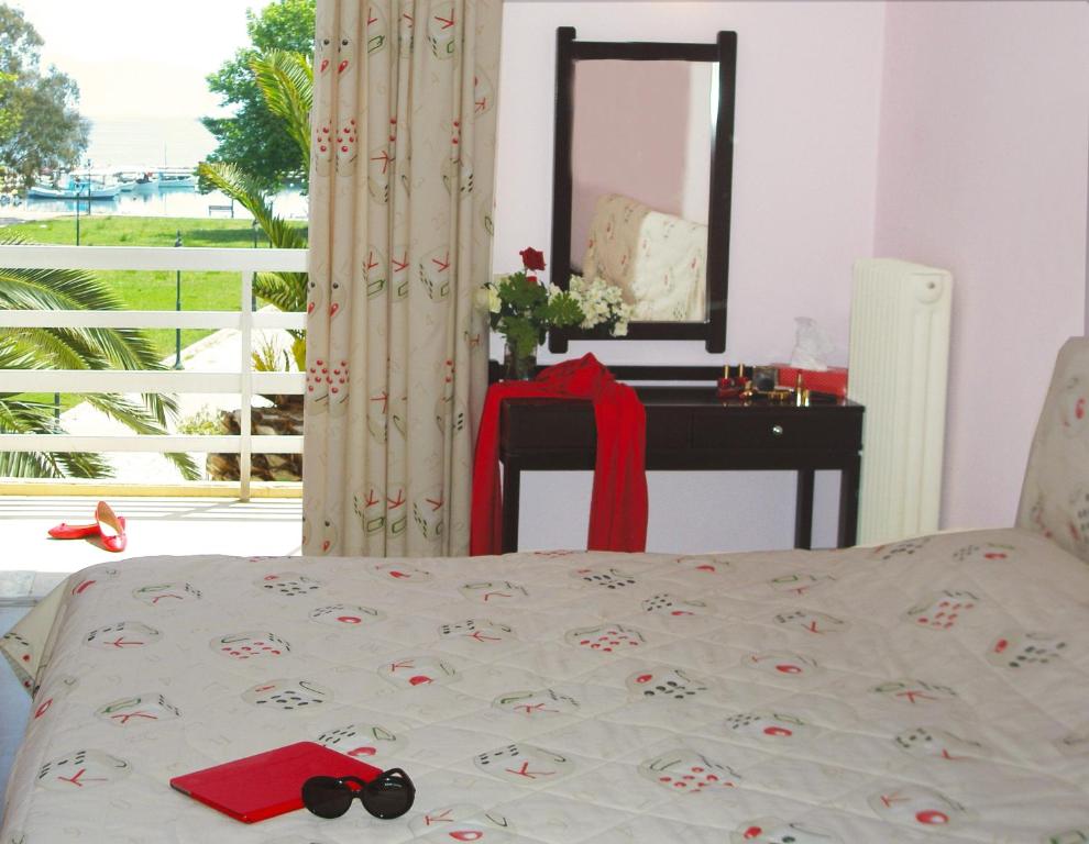 Postel nebo postele na pokoji v ubytování Hotel Florakis