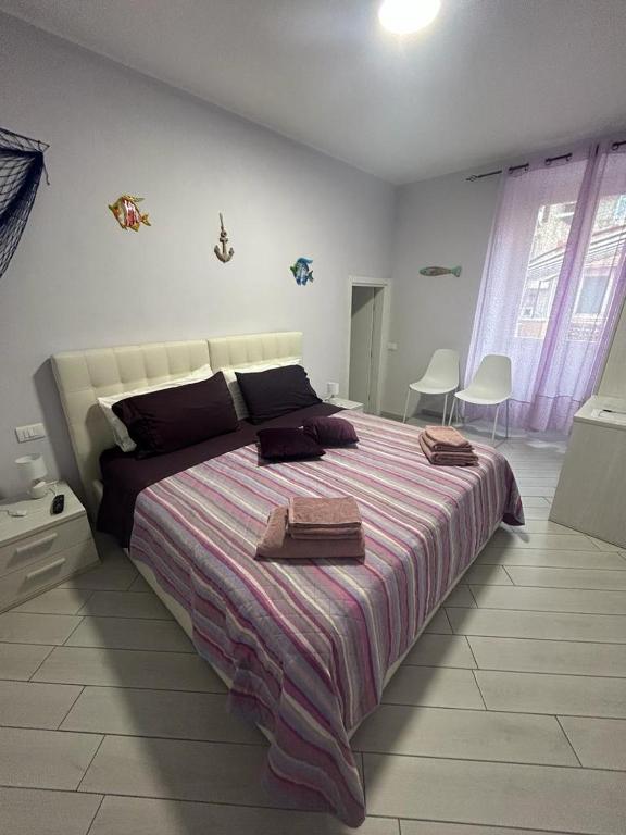 A bed or beds in a room at b&b La Rosa dei venti