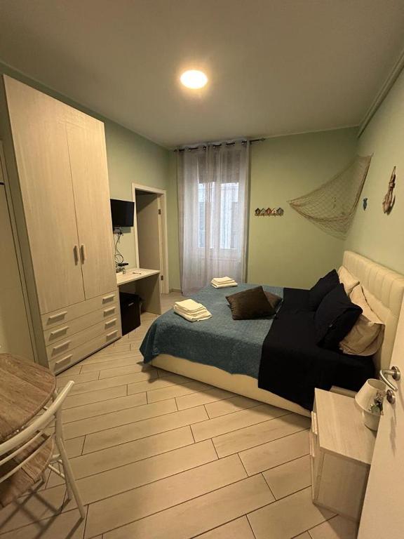 A bed or beds in a room at b&b La Rosa dei venti