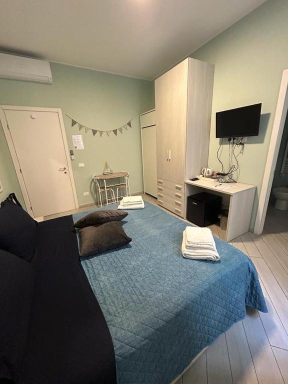 A bed or beds in a room at b&b La Rosa dei venti