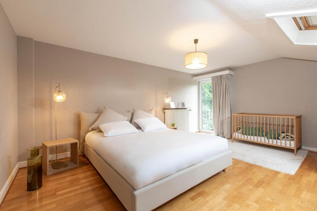 Una cama o camas en una habitaci&oacute;n de La VILLA du Reims