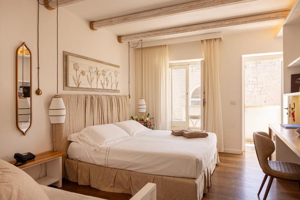 Postel nebo postele na pokoji v ubytování Masseria Bandino & Spa
