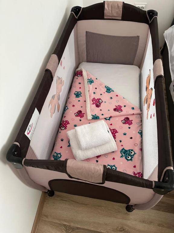 a suitcase with a hello kitty bed in a room at DREAMS ESCAPE 2 in Craiova