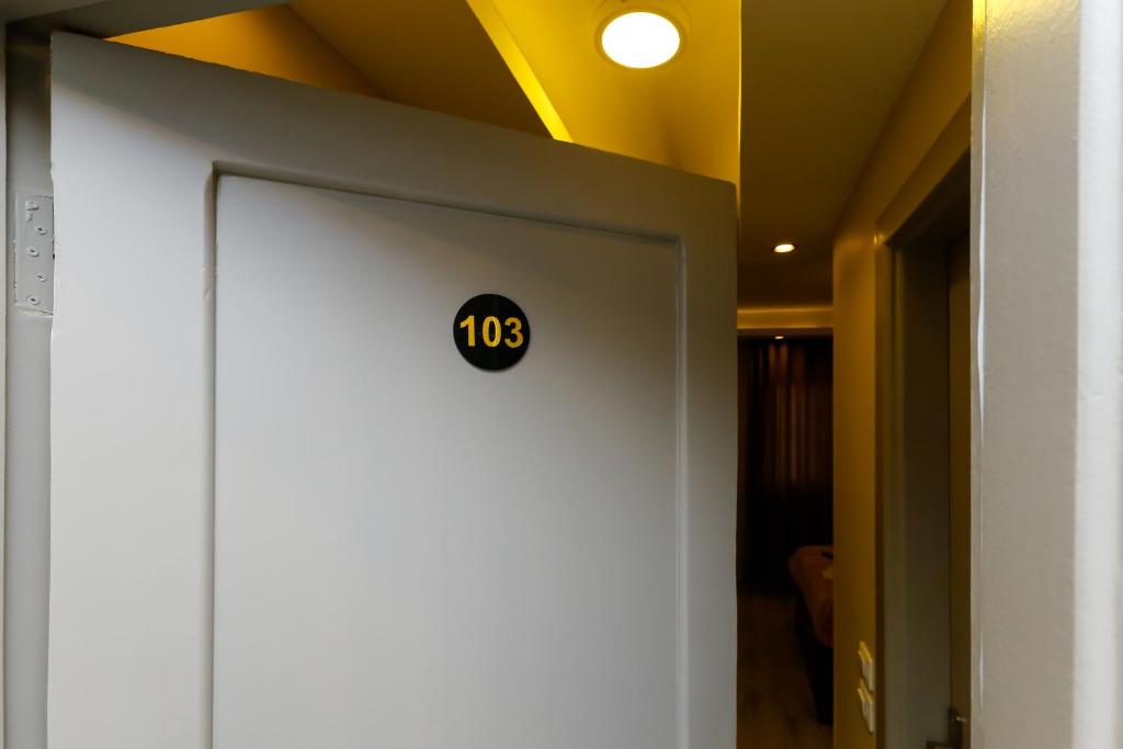 a door with a clock on it in a room at Venus Pyramids Inn - Top Roof Access W Free Break Fast in Cairo