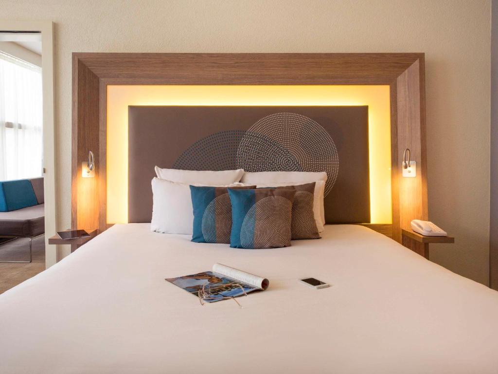 Postel nebo postele na pokoji v ubytování Novotel Genève Centre