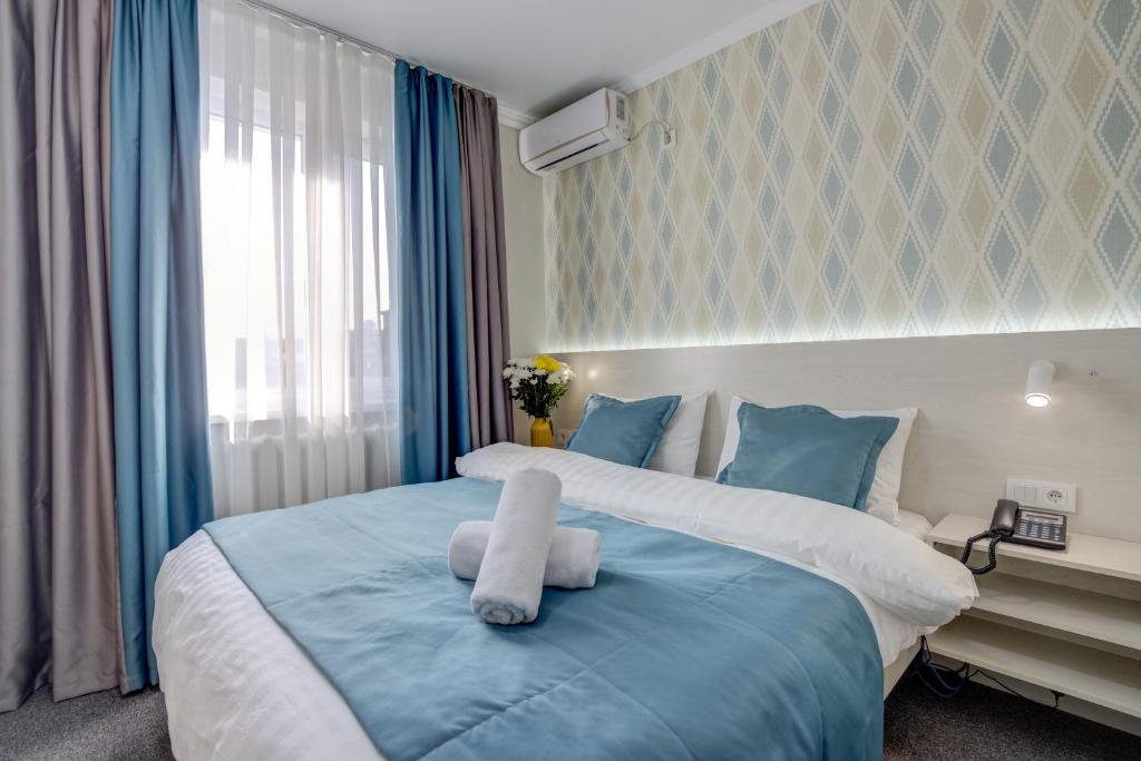 Postel nebo postele na pokoji v ubytování Viva Hotel