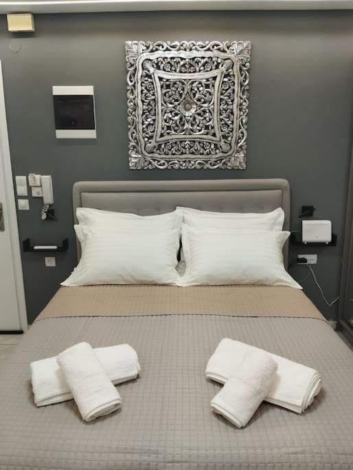 Postel nebo postele na pokoji v ubytování Kentrikon Guest House