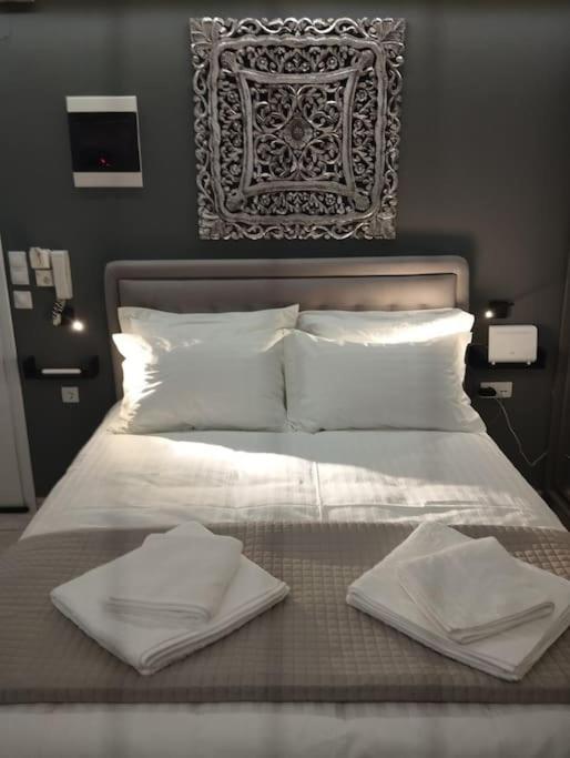 Postel nebo postele na pokoji v ubytování Kentrikon Guest House