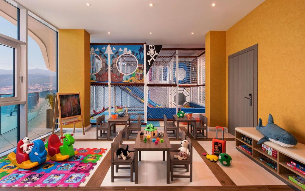 Televízia a/alebo spoločenská miestnosť v ubytovaní Hilton Rijeka Costabella Beach Resort And Spa
