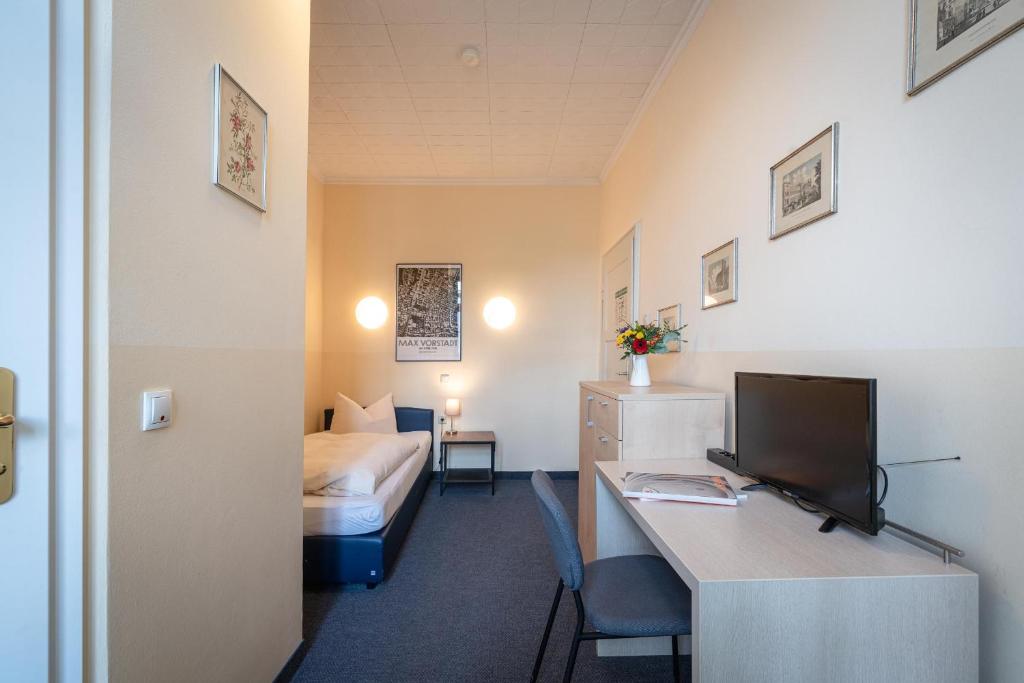 TV a/nebo společenská místnost v ubytování Hotel-Pension am Siegestor